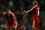 LIVERPOOL, UNITED KINGDOM - APRIL 21:  Javier Mascherano (L) of Liverpool and team mate Fernando Torres show their dejection during the Barclays Premier League match between Liverpool and Arsenal at Anfield on April 21, 2009 in Liverpool, England.  (Photo by Alex Livesey/Getty Images)