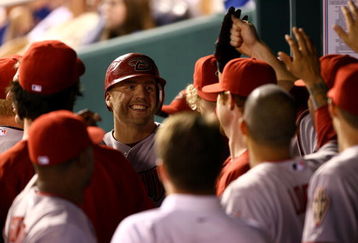 KANSAS CITY, MO - JUNE 17:  Mark Reynolds #27 of the Arizona Diamondbacks is congratulated in the dugout after hitting a 2-run home run during the 7th inning of the game on June 17, 2009 at Kauffman Stadium in Kansas City, Missouri.  (Photo by Jamie Squire/Getty Images)
