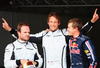 BARCELONA, SPAIN - MAY 09:  (L-R) Third placed Rubens Barrichello of Brazil and Brawn GP, pole sitter Jenson Button of Great Britain and Brawn GP and second placed Sebastian Vettel of Germany and Red Bull Racing celebrate in parc ferem following qualifying for the Spanish Formula One Grand Prix at the Circuit de Catalunya on May 9, 2009 in Barcelona, Spain.  (Photo by Clive Mason/Getty Images)