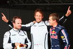 BARCELONA, SPAIN - MAY 09:  (L-R) Third placed Rubens Barrichello of Brazil and Brawn GP, pole sitter Jenson Button of Great Britain and Brawn GP and second placed Sebastian Vettel of Germany and Red Bull Racing celebrate in parc ferem following qualifying for the Spanish Formula One Grand Prix at the Circuit de Catalunya on May 9, 2009 in Barcelona, Spain.  (Photo by Clive Mason/Getty Images)