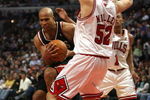 CHICAGO - MARCH 06:  Richard Jefferson #24 of the Milwaukee Bucks drives the lane against Brad Miller #52 of the Chicago Bulls at the United Center on March 6, 2009 in Chicago, Illinois.  NOTE TO USER: User expressly acknowledges and agreees that, by downloading and/or using this Photograph, User is consenting to the terms and conditions of the Getty Images License Agreement.  (Photo by Jonathan Daniel/Getty Images)
