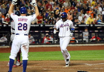 NEW YORK - JUNE 22:  Luis Castillo #1 of the New York Mets scores a run in the sixth inning against the St. Louis Cardinals on June 22, 2009 at Citi Field in the Flushing neighborhood of the Queens borough of New York City.  (Photo by Jim McIsaac/Getty Images)