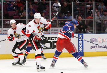 NEW YORK - MARCH 22:  Dany Heatley #15 of the Ottawa Senators skates with the puck under pressure from Marc Staal #18  of the New York Rangers on March 22, 2009 at Madison Square Garden in New York City, New York.  (Photo by Nick Laham/Getty Images)