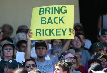 OAKLAND, CA - AUGUST 11:  A fan of the Oakland Athletics holds up a sign in support of Rickey Henderson during a game against the Los Angeles Angels of Anaheim at McAfee Coliseum on August 11, 2005 in Oakland, California. The A's defeated the Angels 5-4.  (Photo by Jed Jacobsohn/Getty Images)