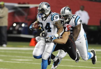 ATLANTA - NOVEMBER 23: Running back DeAngelo Williams #34 of the Carolina Panthers rushes upfield against the Atlanta Falcons at the Georgia Dome on November 23, 2008 in Atlanta, Georgia.  (Photo by Al Messerschmidt/Getty Images)