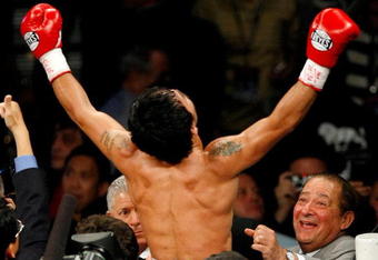LAS VEGAS - MAY 02:  Manny Pacquiao of the Philippines celebrates with promoter Bob Arum after defeating Ricky Hatton of England in the second round of their junior welterweight title fight at the MGM Grand Garden Arena May 2, 2009 in Las Vegas, Nevada.  (Photo by Ethan Miller/Getty Images)