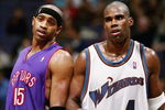 WAHINGTON DC - NOVEMBER 23:  Antawn Jamison #4 of the Washington Wizards and Vince Carter #15 of the Toronoto Raptors talk during a free throw as the Wizards defeated the Raptors 102-86 November 23, 2004 at the MCI Center in Washington D.C.  NOTE TO USER:  User expressly acknowledges and agrees that, by downloading and or using this photograph, User is consenting to the terms and conditions of the Getty Images License Agreement.  (Photo by Doug Pensinger/Getty Images)