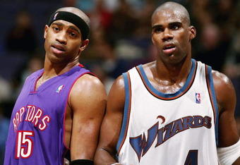 WAHINGTON DC - NOVEMBER 23:  Antawn Jamison #4 of the Washington Wizards and Vince Carter #15 of the Toronoto Raptors talk during a free throw as the Wizards defeated the Raptors 102-86 November 23, 2004 at the MCI Center in Washington D.C.  NOTE TO USER:  User expressly acknowledges and agrees that, by downloading and or using this photograph, User is consenting to the terms and conditions of the Getty Images License Agreement.  (Photo by Doug Pensinger/Getty Images)
