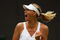 WIMBLEDON, ENGLAND - JUNE 22:  Maria Sharapova of Russia celebrates during the women's singles first round match against Viktoriya Kutuzova of Ukraine on Day One of the Wimbledon Lawn Tennis Championships at the All England Lawn Tennis and Croquet Club on June 22, 2009 in London, England.  (Photo by Julian Finney/Getty Images)