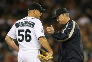 SEATTLE  - SEPTEMBER 16:  Starting pitcher Jarrod Washburn #56 of the Seattle Mariners is removed from the game in the fifth inning by manager John McLaren #8 against the Tampa Bay Devil Rays on September 16, 2007 at Safeco Field in Seattle, Washington. Catcher Jamie Burke #15 is at right. (Photo by Otto Greule Jr/Getty Images)