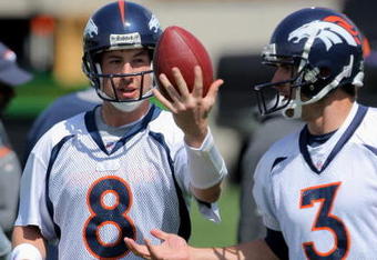 ENGLEWOOD, CO - MAY 03:  Quarterback Kyle Orton #8 has the ball jokingly tipped form his hands by sixth round draft pick rookie quarterback Tom Brandslater #3 during Denver Broncos Minicamp at the Broncos training facility on May 3, 2009 in Englewood, Colorado.  (Photo by Doug Pensinger/Getty Images)