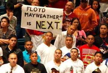 LAS VEGAS - MAY 01:  A sign for Floyd Mayweather Jr. is held as boxing fans wait for the official weigh-in for the junior welterweight title fight between Ricky Hatton of England and Manny Pacquiao of the Philippines at the MGM Grand Garden Arena May 1, 2009 in Las Vegas, Nevada. It was reported that on May 2 Mayweather will announce the end of his retirement to fight Juan Manuel Marquez.  (Photo by Ethan Miller/Getty Images)