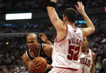 CHICAGO - MARCH 06:  Richard Jefferson #24 of the Milwaukee Bucks drives the lane against Brad Miller #52 of the Chicago Bulls at the United Center on March 6, 2009 in Chicago, Illinois.  NOTE TO USER: User expressly acknowledges and agreees that, by downloading and/or using this Photograph, User is consenting to the terms and conditions of the Getty Images License Agreement.  (Photo by Jonathan Daniel/Getty Images)