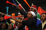 BLOEMFONTEIN, SOUTH AFRICA - JUNE 20:  Bafana Bafana supporters cheer holding their vuvuzelas prior to the FIFA Confederations Cup match between Spain and South Africa at Free State Stadium on June 20, 2009 in Bloemfontein, South Africa.  (Photo by Jasper Juinen/Getty Images)