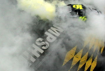 LOUDON, NH - SEPTEMBER 14:  Greg Biffle, driver of the #16 Dish Network Turbo HD Ford, does a burnout following his victory in the NASCAR Sprint Cup Series Sylvania 300 at New Hampshire Motor Speedway on September 14, 2008 in Loudon, New Hampshire.  (Photo by Chris Trotman/Getty Images for NASCAR)