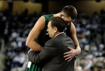 DETROIT - APRIL 06:  Goran Suton #14 of the Michigan State Spartans hugs head coach Tom Izzo after Suton came out of the game late in the second half against the North Carolina Tar Heels during the 2009 NCAA Division I Men's Basketball National Championship game at Ford Field on April 6, 2009 in Detroit, Michigan. North Carolina (Photo by Andy Lyons/Getty Images)