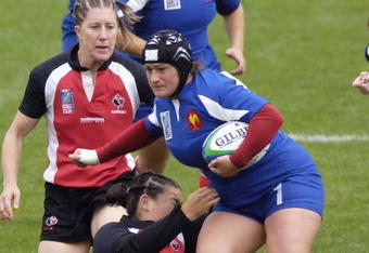 EDMONTON, AB - SEPTEMBER 17:   Dani?le Irazu (R) of France pushes past Julia Suguwara of Canada in the Bronze medal match during day six of the Women's Rugby World Cup 2006 at the Commonwealth Stadium on September 17, 2006 in Edmonton, Alberta, Canada.  (Photo by Jimmy Jeong/Getty Images) 