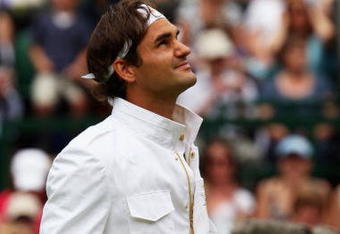 WIMBLEDON, ENGLAND - JUNE 22:  Roger Federer of Switzerland looks on prior to the men's singles first round match against Yen-Hsun Lu of Chinese Taipei on Day One of the Wimbledon Lawn Tennis Championships at the All England Lawn Tennis and Croquet Club on June 22, 2009 in London, England.  (Photo by Clive Brunskill/Getty Images)