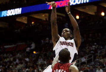 ATLANTA - MAY 03:  Joe Johnson #2 of the Atlanta Hawks shoots over James Jones #22 of the Miami Heat during Game Seven of the Eastern Conference Quarterfinals at Philips Arena on May 3, 2009 in Atlanta, Georgia. The Hawks defeated the Heat 91-78. NOTE TO USER: User expressly acknowledges and agrees that, by downloading and/or using this Photograph, user is consenting to the terms and conditions of the Getty Images License Agreement.  (Photo by Doug Benc/Getty Images)