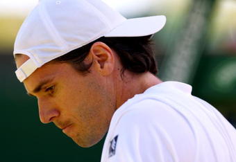 WIMBLEDON, ENGLAND - JUNE 23:  Tommy Haas of Germany looks on during the men's singles first round match against Alexander Peya of Austria on Day Two of the Wimbledon Lawn Tennis Championships at the All England Lawn Tennis and Croquet Club on June 23, 2009 in London, England.  (Photo by Clive Brunskill/Getty Images)