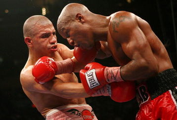 NEW YORK - JUNE 09:  Miguel Cotto of Puerto Rico lands a left on Zab Judah during their WBA Welterweight Championship bout on June 9, 2007 at Madison Square Garden in New York City.  (Photo by Nick Laham/Getty Images)