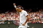 WIMBLEDON, ENGLAND - JUNE 22:  Roger Federer of Switzerland celebrates during the men's singles first round match against Yen-Hsun Lu of Chinese Taipei on Day One of the Wimbledon Lawn Tennis Championships at the All England Lawn Tennis and Croquet Club on June 22, 2009 in London, England.  (Photo by Clive Brunskill/Getty Images)