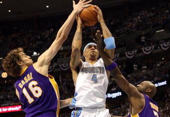 DENVER - MAY 29:  Carmelo Anthony #15 of the Denver Nuggets drives between Lamar Odom #7 and Pau Gasol #16 of the Los Angeles Lakers in Game Six of the Western Conference Finals during the 2009 NBA Playoffs at Pepsi Center on May 29, 2009 in Denver, Colorado. NOTE TO USER: User expressly acknowledges and agrees that, by downloading and or using this photograph, User is consenting to the terms and conditions of the Getty Images License Agreement.  (Photo by Jed Jacobsohn/Getty Images)