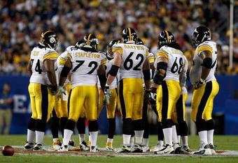 TAMPA, FL - FEBRUARY 01: Offensive linemen (L-R) Willie Colon #74, Darnell Stapleton #72, Justin Hartwig #62,  Chris Kemoeatu #68 and Max Starks #78 of the Pittsburgh Steelers stand in the huddle against the Arizona Cardinals during Super Bowl XLIII on February 1, 2009 at Raymond James Stadium in Tampa, Florida.  (Photo by Chris Graythen/Getty Images) Steelers won 27-23.
