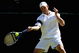 WIMBLEDON, ENGLAND - JUNE 23:  Andy Roddick of USA plays a forehand during the men's singles first round match against Jeremy Chardy of France on Day Two of the Wimbledon Lawn Tennis Championships at the All England Lawn Tennis and Croquet Club on June 23, 2009 in London, England.  (Photo by Julian Finney/Getty Images)