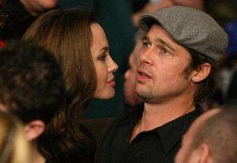 LAS VEGAS - DECEMBER 08:  Actors Angelina Jolie and Brad Pitt talk before the fight between Ricky Hatton of England and Floyd Mayweather Jr. prior to their WBC world welterweight championship fight at the MGM Grand Garden Arena on December 8, 2007 in Las Vegas, Nevada.  (Photo by Al Bello/Getty Images)