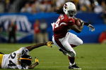 TAMPA, FL - FEBRUARY 01:  Tim Hightower #34 of the Arizona Cardinals runs the ball against Ike Taylor #24 of the Pittsburgh Steelers during Super Bowl XLIII on February 1, 2009 at Raymond James Stadium in Tampa, Florida.  (Photo by Chris Graythen/Getty Images)