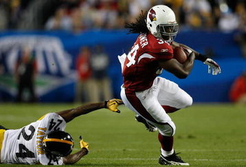TAMPA, FL - FEBRUARY 01:  Tim Hightower #34 of the Arizona Cardinals runs the ball against Ike Taylor #24 of the Pittsburgh Steelers during Super Bowl XLIII on February 1, 2009 at Raymond James Stadium in Tampa, Florida.  (Photo by Chris Graythen/Getty Images)