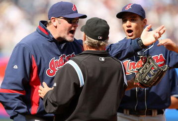 NEW YORK - APRIL 19:  Cleveland Indians manager Eric Wedge and Grady Sizemore #24 argue with the umpire about a pinch hit two-run home run by Jorge Posada of the New York Yankees in the seventh inning of their game against the Cleveland Indians at Yankee Stadium on April 19, 2009 in the Bronx borough of New York City.  The hit was reviewed by instant replay, and was ruled a home run.  (Photo by Ezra Shaw/Getty Images)