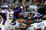 DENVER - DECEMBER 30:  Brandon Marshall #15 of the Denver Broncos can't hold on to this touchdown pass attempt as he's surrounded by E. J. Henderson #56, Darren Sharper #42 and Dwight Smith #24 of the Minnesota Vikings in the third quarter of the football game at Invesco Field at Mile High December 30, 2007 in Denver, Colorado. (Photo by Steve Dykes/Getty Images)