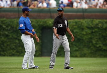 CHICAGO - JUNE 18:  Derrek Lee #25 of the Chicago Cubs speaks with Jermaine Dye #23 of the Chicago White Sox before the game on June 18, 2009 at Wrigley Field in Chicago, Illinois. (Photo by Jonathan Daniel/Getty Images)