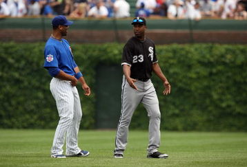 CHICAGO - JUNE 18:  Derrek Lee #25 of the Chicago Cubs speaks with Jermaine Dye #23 of the Chicago White Sox before the game on June 18, 2009 at Wrigley Field in Chicago, Illinois. (Photo by Jonathan Daniel/Getty Images)