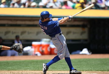 OAKLAND, CA - MAY 07:  Ian Kinsler #5 of the Texas Rangers bats against the Oakland Athletics during a Major League Baseball game on May 7, 2009 at the Oakland Coliseum in Oakland, California.  (Photo by Jed Jacobsohn/Getty Images)