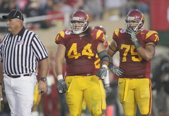 PASADENA, CA - JANUARY 1:  Christian Tupou #44 of the USC Trojans and Fili Moala #75 look on against the Penn State Nittany Lions on January 1, 2009 at the Rose Bowl in Pasadena, California.  USC won 38-24.  (Photo by Jeff Golden/Getty Images)