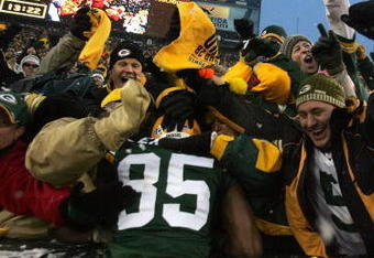 GREEN BAY, WI - JANUARY 12:  Wide receiver Greg Jennings #85 of the Green Bay Packers celebrates with a 'Lambeau leap' after catching a two-yard touchdown pass in the second quarter against the Seattle Seahawks during the NFC divisional playoff game on January 12, 2008 at Lambeau Field in Green Bay, Wisconsin.  (Photo by Jonathan Daniel/Getty Images)