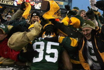 GREEN BAY, WI - JANUARY 12:  Wide receiver Greg Jennings #85 of the Green Bay Packers celebrates with a 'Lambeau leap' after catching a two-yard touchdown pass in the second quarter against the Seattle Seahawks during the NFC divisional playoff game on January 12, 2008 at Lambeau Field in Green Bay, Wisconsin.  (Photo by Jonathan Daniel/Getty Images)