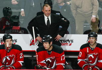NEWARK, NJ - APRIL 03: Head Coach Brent Sutter of the New Jersey Devils watches the action against the Tampa Bay Lightning on April 3, 2009 at the Prudential Center in Newark, New Jersey. The Devils defeated the Lightning 5-4 in overtime. (Photo by Bruce Bennett/Getty Images)