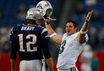 FOXBORO, MA - DECEMBER 23: Tom Brady #12 of the New England Patriots chats with Jay Feely #3 of the Miami Dolphins before their game at Gillette Stadium on December 23, 2007 in Foxboro, Massachusetts. Patriots won 28-7. (Photo by Jim Rogash/Getty Images)