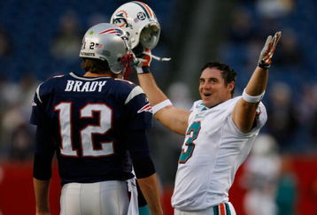 FOXBORO, MA - DECEMBER 23: Tom Brady #12 of the New England Patriots chats with Jay Feely #3 of the Miami Dolphins before their game at Gillette Stadium on December 23, 2007 in Foxboro, Massachusetts. Patriots won 28-7. (Photo by Jim Rogash/Getty Images)