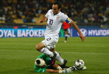 RUSTENBURG, SOUTH AFRICA - JUNE 21:  Essam El Hadary of Egypt saves at the feet of Landon Donovan of USA during the FIFA Confederations Cup match between Egypt and USA at Royal Bafokeng Stadium on June 21, 2009 in Rustenburg, South Africa.  (Photo by Jamie McDonald/Getty Images)