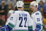 DETROIT - JANUARY 17:  The Sedin brothers Daniel #22 and Henrik #33 of the Vancouver Canucks chat prior to a faceoff in a game against the Detroit Red Wings on January 17, 2008 at the Joe Louis Arena in Detroit, Michigan. The Wings defeated the Canucks 3-2 in a shootout. (Photo by Claus Andersen/Getty Images)