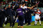 BLOEMFONTEIN, SOUTH AFRICA - JUNE 24:  Landon Donovan  #10 Benny Feilhaber#22 od USA celebrate with their bench players a goal by Clint Dempsey #8 of USA  of Spain looks on during the FIFA Confederations Cup Semi Final match between Spain and USA at the Free State stadium on June 24, 2009 in Bloemfontein, South Africa.  (Photo by Kevork Djansezian/Getty Images)