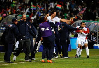 BLOEMFONTEIN, SOUTH AFRICA - JUNE 24:  Landon Donovan  #10 Benny Feilhaber#22 od USA celebrate with their bench players a goal by Clint Dempsey #8 of USA  of Spain looks on during the FIFA Confederations Cup Semi Final match between Spain and USA at the Free State stadium on June 24, 2009 in Bloemfontein, South Africa.  (Photo by Kevork Djansezian/Getty Images)
