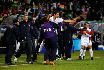 BLOEMFONTEIN, SOUTH AFRICA - JUNE 24:  Landon Donovan  #10 Benny Feilhaber#22 od USA celebrate with their bench players a goal by Clint Dempsey #8 of USA  of Spain looks on during the FIFA Confederations Cup Semi Final match between Spain and USA at the Free State stadium on June 24, 2009 in Bloemfontein, South Africa.  (Photo by Kevork Djansezian/Getty Images)