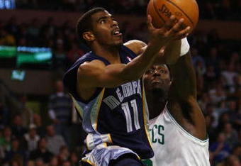 BOSTON - JANUARY 4:  Mike Conley #11 of the Memphis Grizzlies heads for the net as Kevin Garnett #5 of the Boston Celtics defends at the TD Banknorth Garden January 4, 2008 in Boston, Massachusetts. The Celtics defeated the Grizzlies 100-96. NOTE TO USER: User expressly acknowledges and agrees that, by downloading and or using this Photograph, user is consenting to the terms and conditions of the Getty Images License Agreement.  (Photo by Elsa/Getty Images)