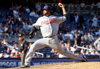 NEW YORK - APRIL 16:  Rafael Perez #53 of the Cleveland Indians pitches against the New York Yankees during opening day at the new Yankee Stadium on April 16, 2009 in the Bronx borough of New York City. This is the first regular season MLB game being played at the new venue which replaced the old Yankee Stadium as the Yankees home field.  (Photo by Jim McIsaac/Getty Images)